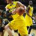 Michigan sophomore Evan Smotrycz moves the ball around Ohio University defense in the second half of the second round of the NCAA tournament at Bridgestone Arena in Nashville, Tenn.  Melanie Maxwell I AnnArbor.com